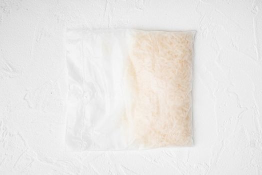 Quick cooking rice bag set, on white stone table background, top view flat lay