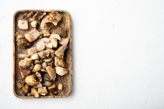 Frozen wild mushrooms set, on white stone background, top view flat lay, with copy space for text