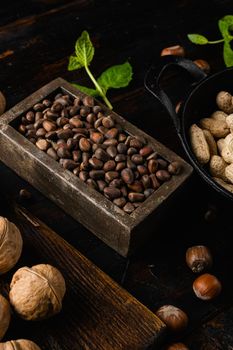 Cedar wild organic nut set, on old dark wooden table background