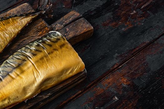 Set of smoked fish mackerel, on old dark wooden table background