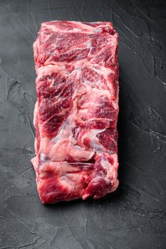 Rib eye beef meat cut raw set, on black stone background, top view flat lay