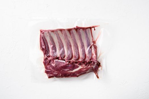 Racks of lamb meat rib fresh pack set, on white stone table background, top view flat lay, with copy space for text