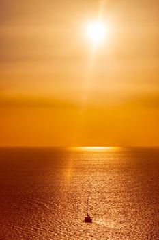 Yacht boats silhouettes in Aegean sea on sunset. Mykonos, Greece