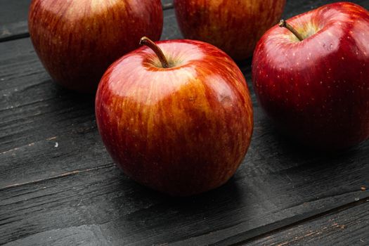 Red apple set, on black wooden table background