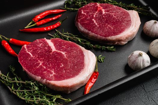 Raw tenderloin steak set, on gray stone table background