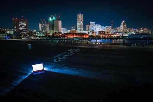 Yokohama Night View and Laptop (Image of Nomad Walker). Shooting Location: Yokohama-city kanagawa prefecture