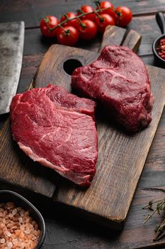 Raw cap rump steak set, on old dark wooden table background