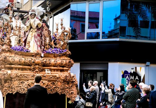 Elche, Spain- April 13, 2022: Easter Parade with bearers and penitents through the streets of Elche city in the Holy Week