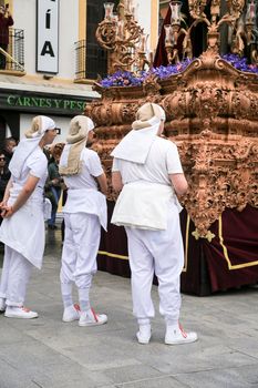 Elche, Spain- April 13, 2022: Bearers of Easter Parade through the streets of Elche city in the Holy Week