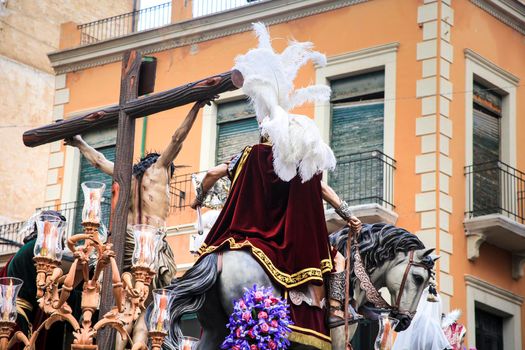 Elche, Spain- April 13, 2022: Easter Parade with bearers and penitents through the streets of Elche city in the Holy Week