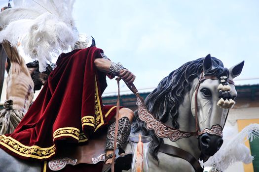 Elche, Spain- April 13, 2022: Easter Parade with bearers and penitents through the streets of Elche city in the Holy Week