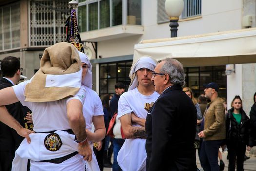Elche, Spain- April 13, 2022: Bearers of Easter Parade through the streets of Elche city in the Holy Week