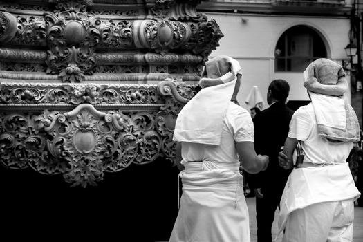 Elche, Spain- April 13, 2022: Bearers of Easter Parade through the streets of Elche city in the Holy Week