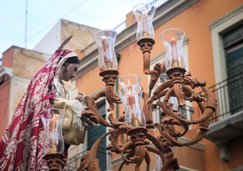 Elche, Spain- April 13, 2022: Easter Parade with bearers and penitents through the streets of Elche city in the Holy Week