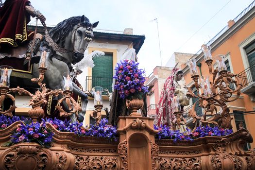 Elche, Spain- April 13, 2022: Easter Parade with bearers and penitents through the streets of Elche city in the Holy Week