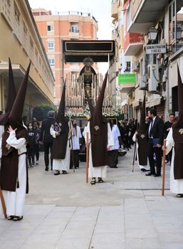 Elche, Spain- April 13, 2022: Virgin Mary on Easter Parade with bearers and penitents through the streets of Elche city in the Holy Week