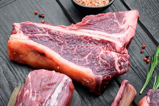 Italian Florentine T bone beef meat Steak set, on black wooden table background