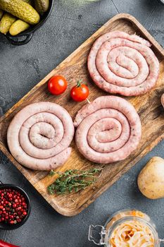 Raw spiral sausage set, on gray background