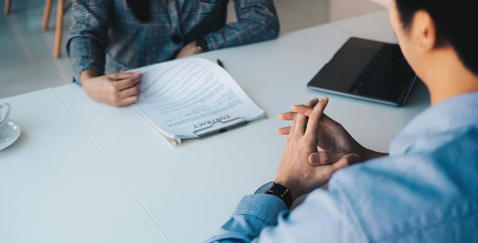 Employer or recruiter reading a resume during about colloquy his profile of candidate, employer conducting a job interview, manager resource employment and recruitment concept