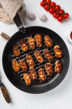 Fried chicken nuggets, on white stone table background, top view flat lay