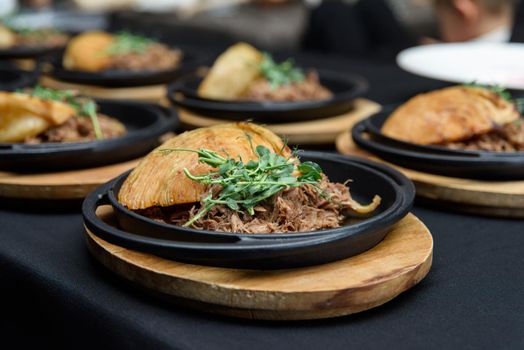 Plate of tasty Swiss dish with venison and cabbage served with herbs.