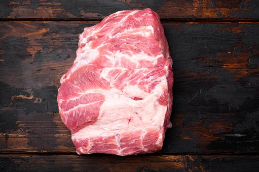 Pork Neck meat steak set, on old dark wooden table background, top view flat lay, with copy space for text