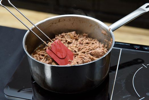 Gurmet venison stew with spices in the pan.