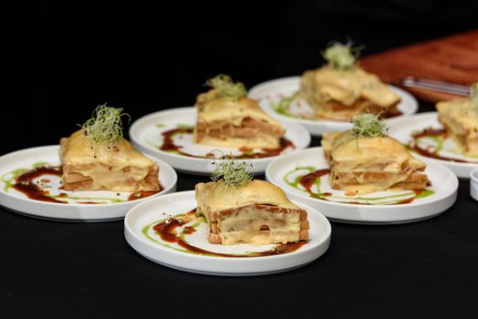 Francesinha, traditional Portuguese sandwich originally from Porto. National cuisine concept. the chef prepares a dish at restaurant.