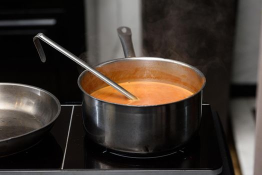 sauce preparation process of Suquet de Peix soup with potatoes.