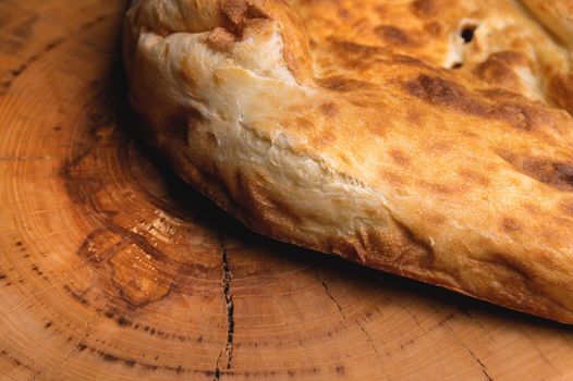 Close-up of fresh appetizing pita bread. delicious baked food.