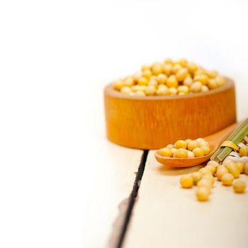 organic soya beans over rustic wood table macro closeup