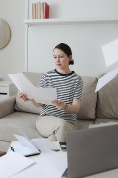 office manager or freelancer in a stylish room. Confident business woman working at workplace in a modern office. Office manager or freelancer work