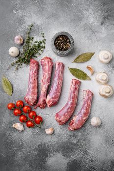 Bird chicken giblets gizzards stomachs set, on gray stone table background, top view flat lay, with copy space for text