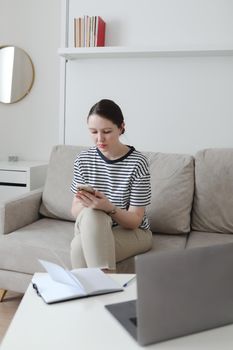 office manager or freelancer in a stylish room. Confident business woman working at workplace in a modern office. Office manager or freelancer work.