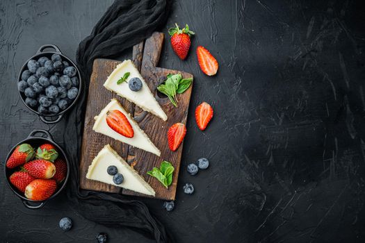 Slices Of Classical New York Cheesecake, on black background, top view flat lay with copy space for text