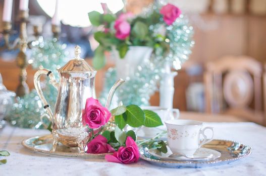 Tea break in English style, vintage silver service against the background of New Year's decor, festive still life, shallow depth of field, light and air