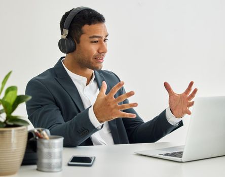 Shot of a businessman on a video call in a modern office.