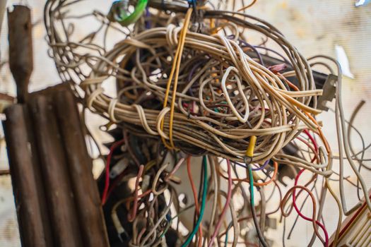 Coiled old wiring from old colored wires close-up. Precious metals in the old