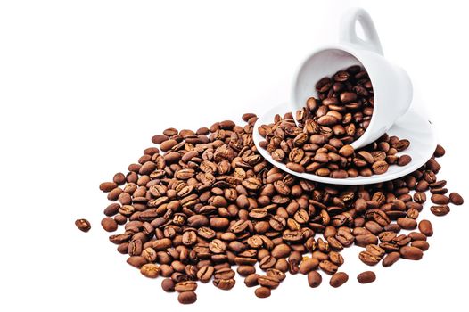 white cup with coffee beans isolated