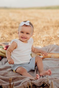 Close Up Portrait of Happy Little Caucasian Girl Having Fun During Family Picnic Outdoors in Field