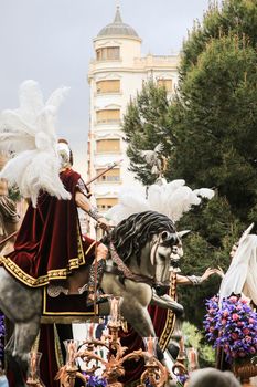 Elche, Spain- April 13, 2022: Easter Parade with bearers and penitents through the streets of Elche city in the Holy Week