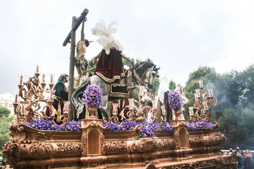 Elche, Spain- April 13, 2022: Easter Parade with bearers and penitents through the streets of Elche city in the Holy Week