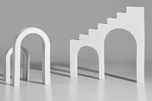 Monochrome illustration with simple architectural elements. White arches of different sizes and stairs with arched openings on light gray background. 3D rendering