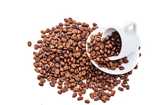 white cup with coffee beans isolated