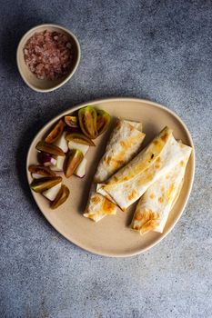 Healthy lunch with tomato and redish salad and potato pies