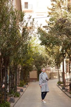 Young blond woman with sunglases on the street.