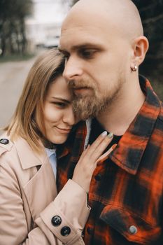 couple of lovers embracing closeup outdoors