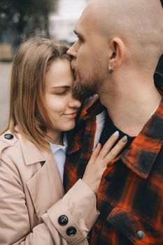 couple of lovers embracing closeup outdoors