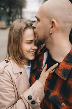 couple of lovers embracing closeup outdoors