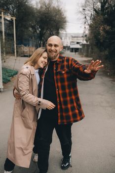 Loving caucasian blond couple walking at street